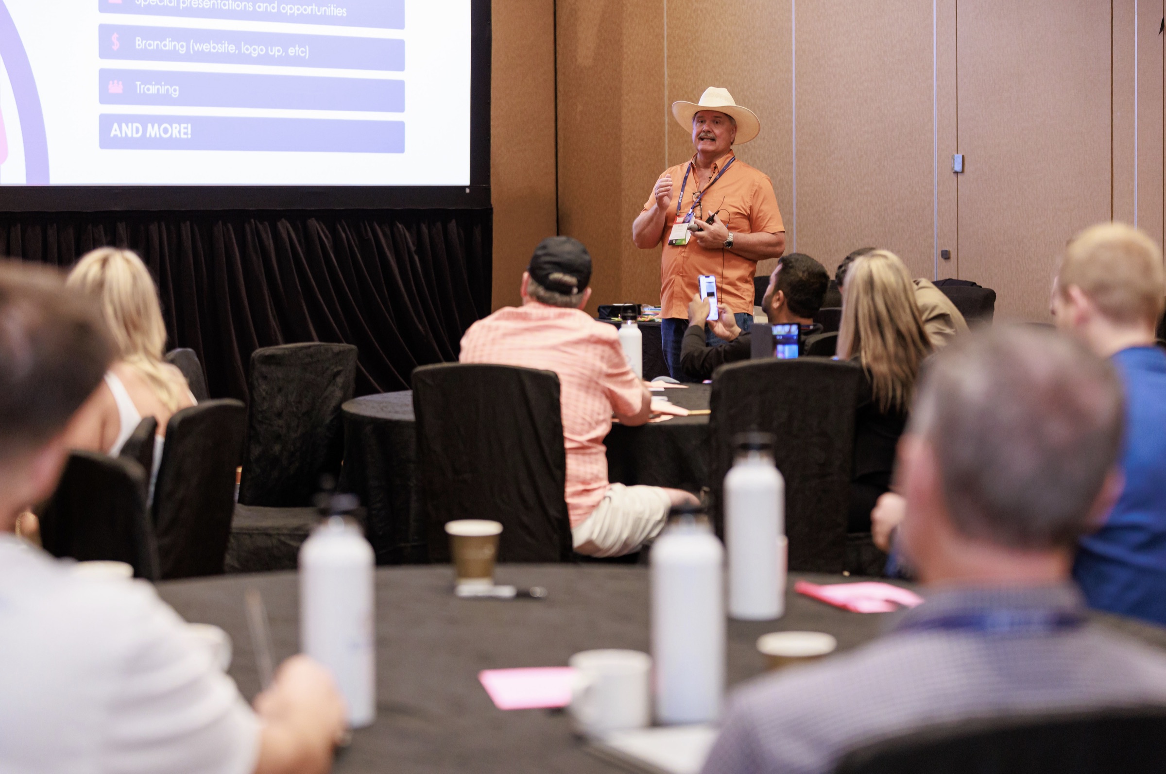 Don Williams delivering a keynote to a conference audience